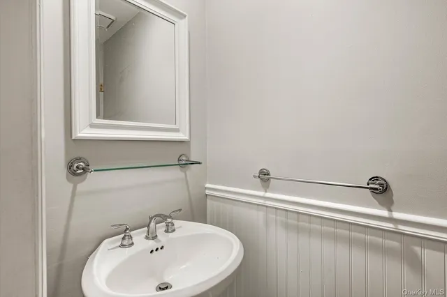 a bathroom with a sink and a window
