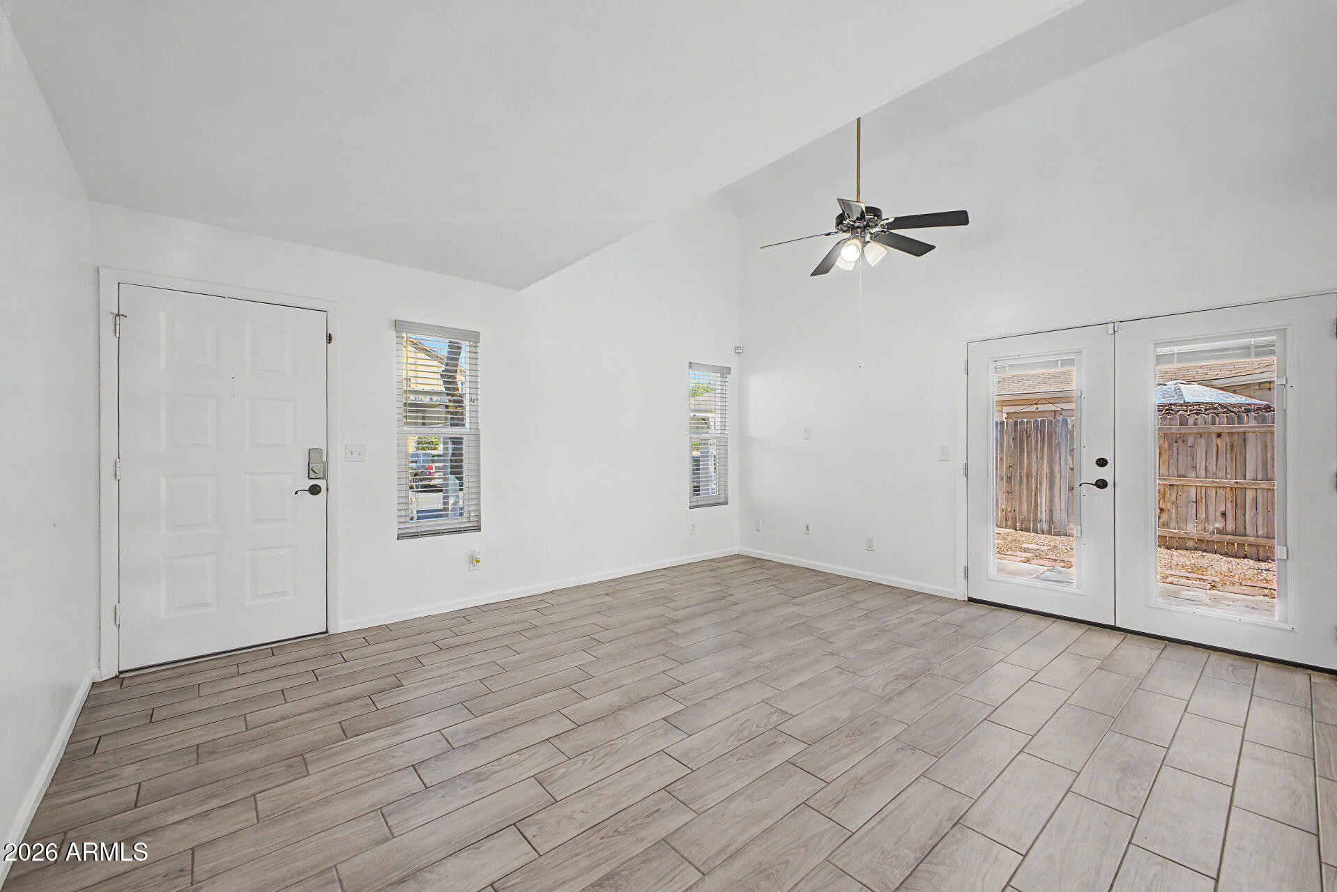 2455 East Broadway Road, Unit 103 Mesa, AZ 85204 - Photo 4 of 22 wooden floor in an empty room with a window