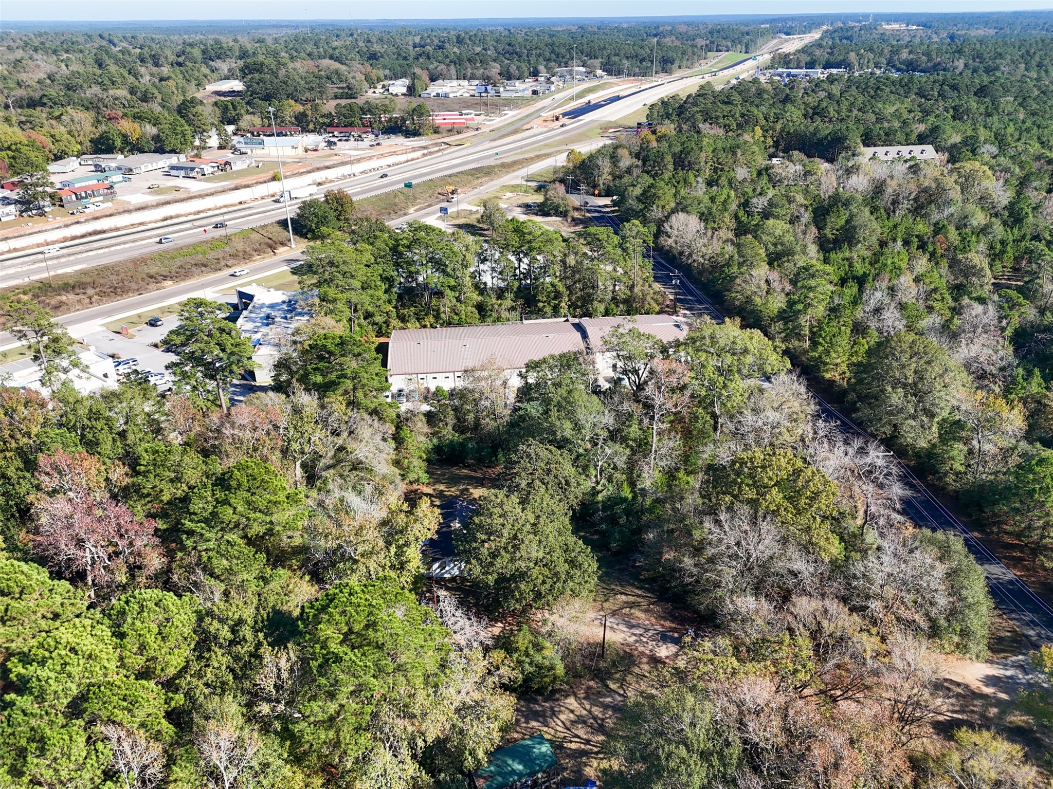 3349 Collard Road Huntsville, TX 77340 - Photo 18 of 22 an aerial view of residential houses with outdoor space and trees