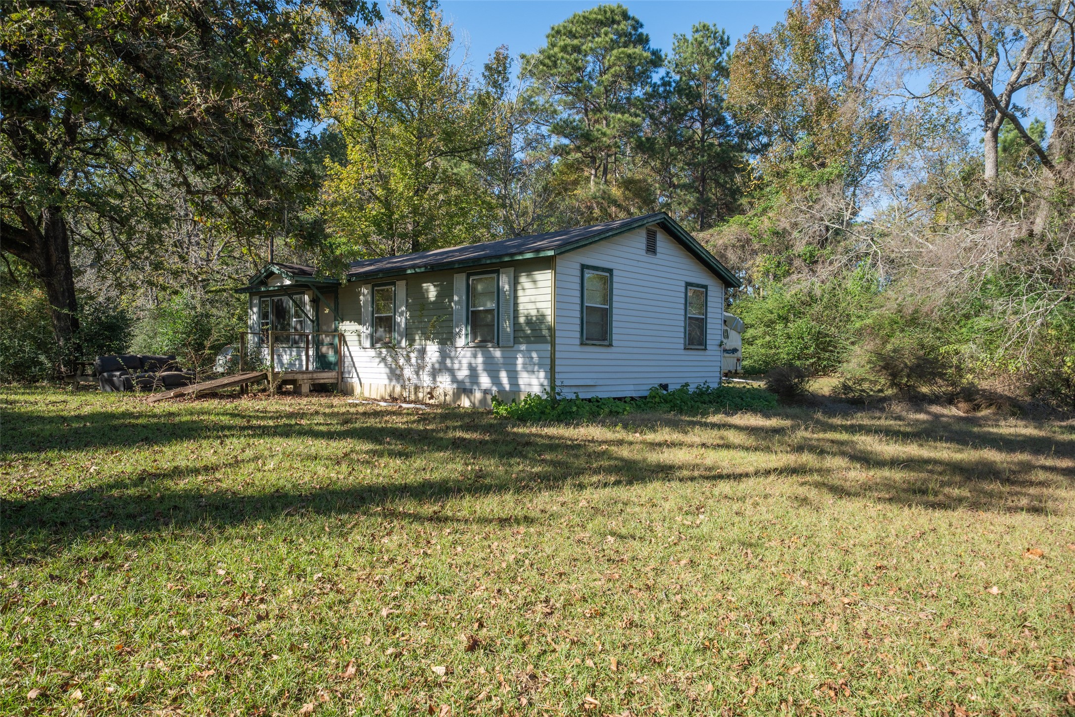 3349 Collard Road Huntsville, TX 77340 - Photo 20 of 22 a house view with a swimming pool