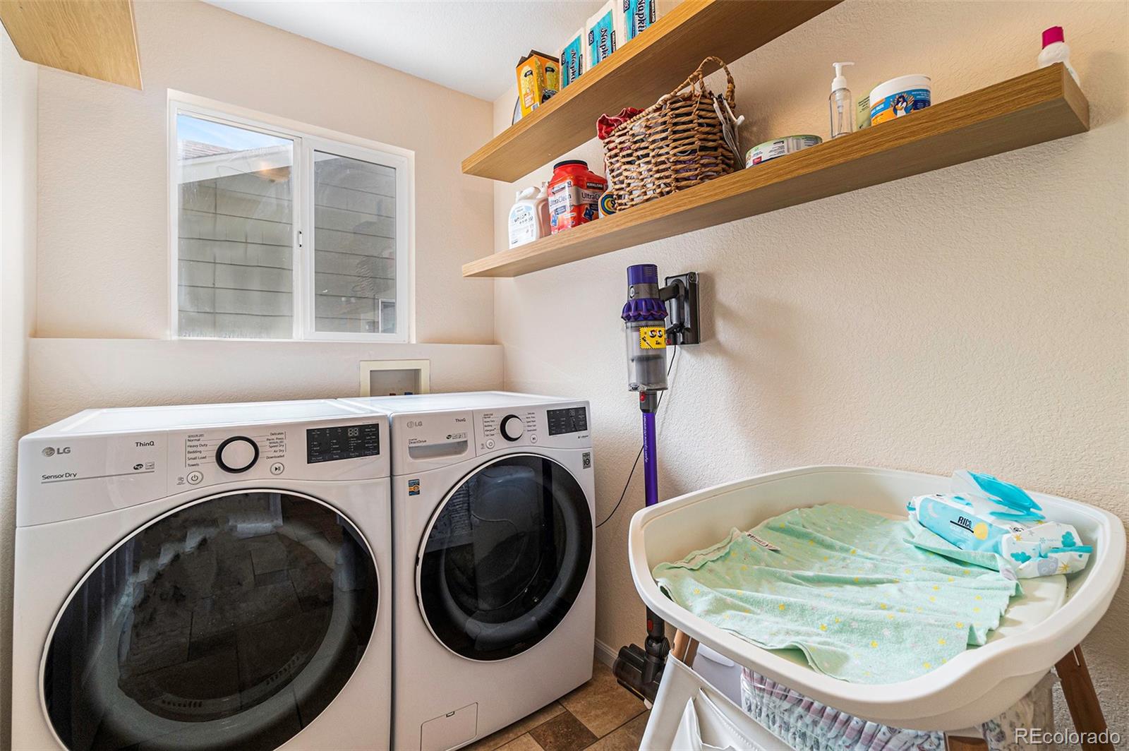 7395 Hickory Circle Frederick, CO 80504 - Photo 12 of 23 a utility room with a washer and dryer