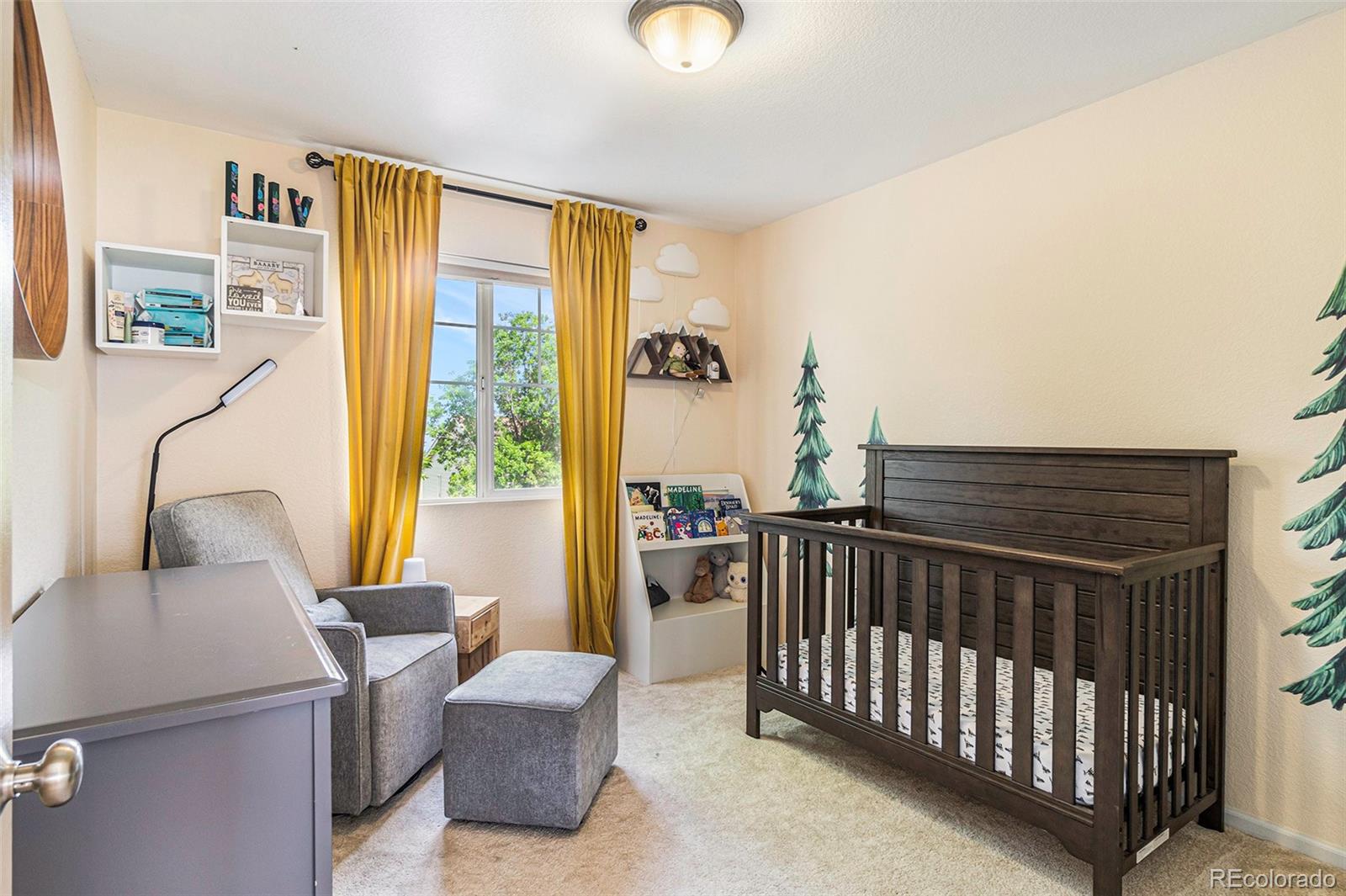 7395 Hickory Circle Frederick, CO 80504 - Photo 15 of 23 a view of a livingroom with furniture and windows