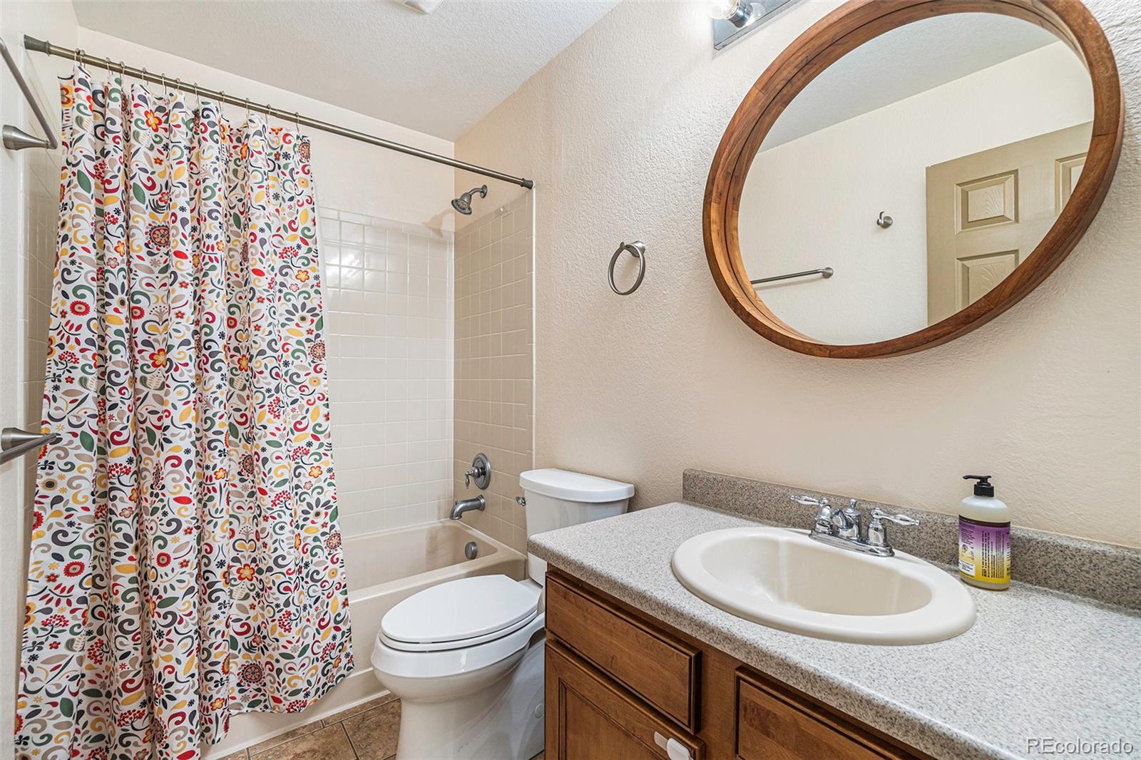 7395 Hickory Circle Frederick, CO 80504 - Photo 17 of 23 a bathroom with a sink a toilet and a mirror