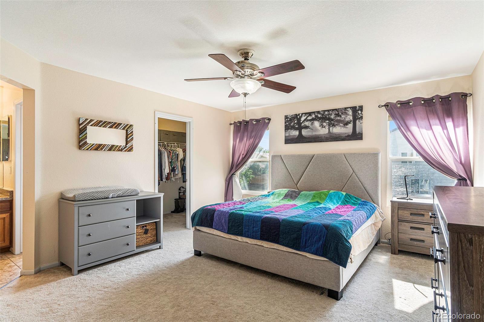 7395 Hickory Circle Frederick, CO 80504 - Photo 18 of 23 a bedroom with a bed dresser and a window