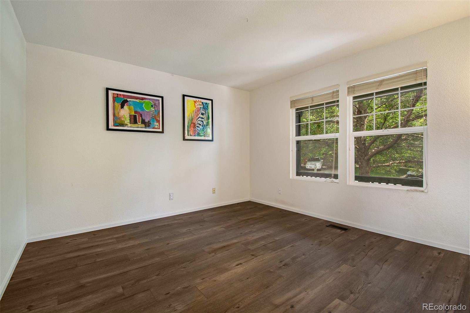7395 Hickory Circle Frederick, CO 80504 - Photo 3 of 23 a view of a room with wooden floor and window