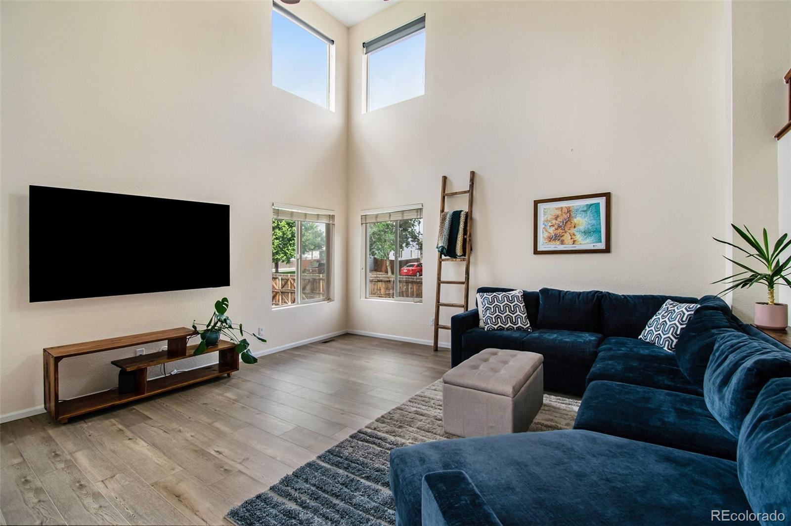 7395 Hickory Circle Frederick, CO 80504 - Photo 5 of 23 a living room with furniture and a flat screen tv