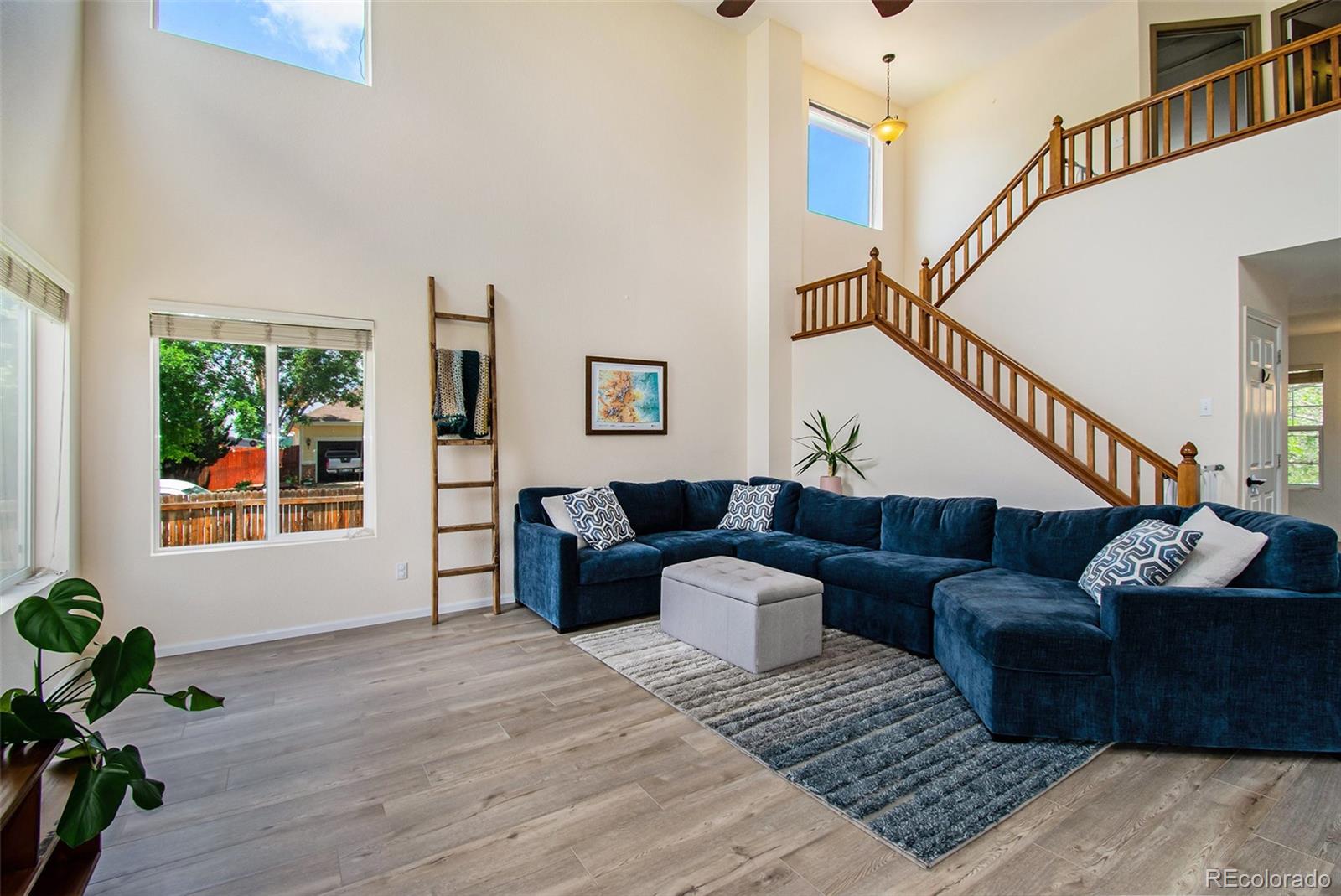 7395 Hickory Circle Frederick, CO 80504 - Photo 7 of 23 a living room with furniture and a wooden floor