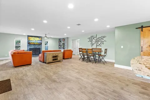 a living room with furniture and a table