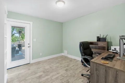 a workspace with furniture and window