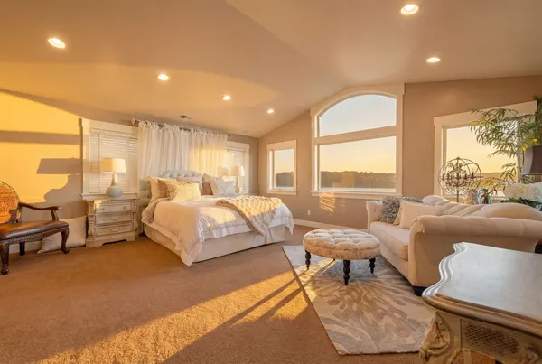 a living room with furniture and a rug