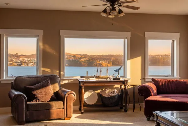 a room with lots of wooden furniture and chairs