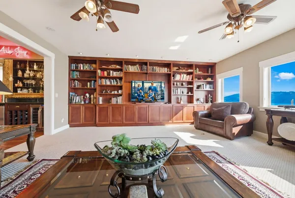 a dining table chair next to a window