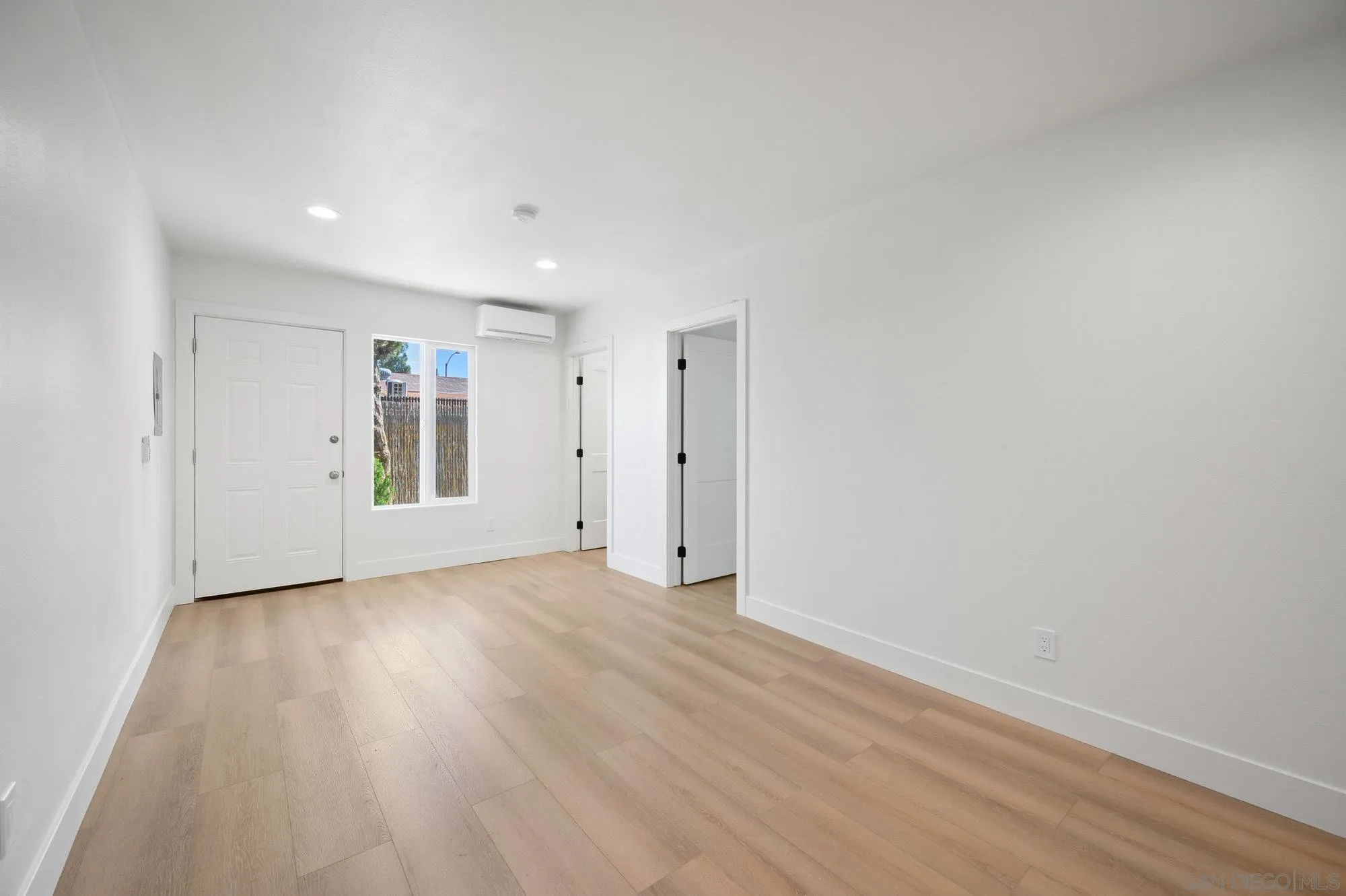 329 North Pico Avenue Fallbrook, CA 92028 - Photo 18 of 23 a view of empty room with wooden floor and window