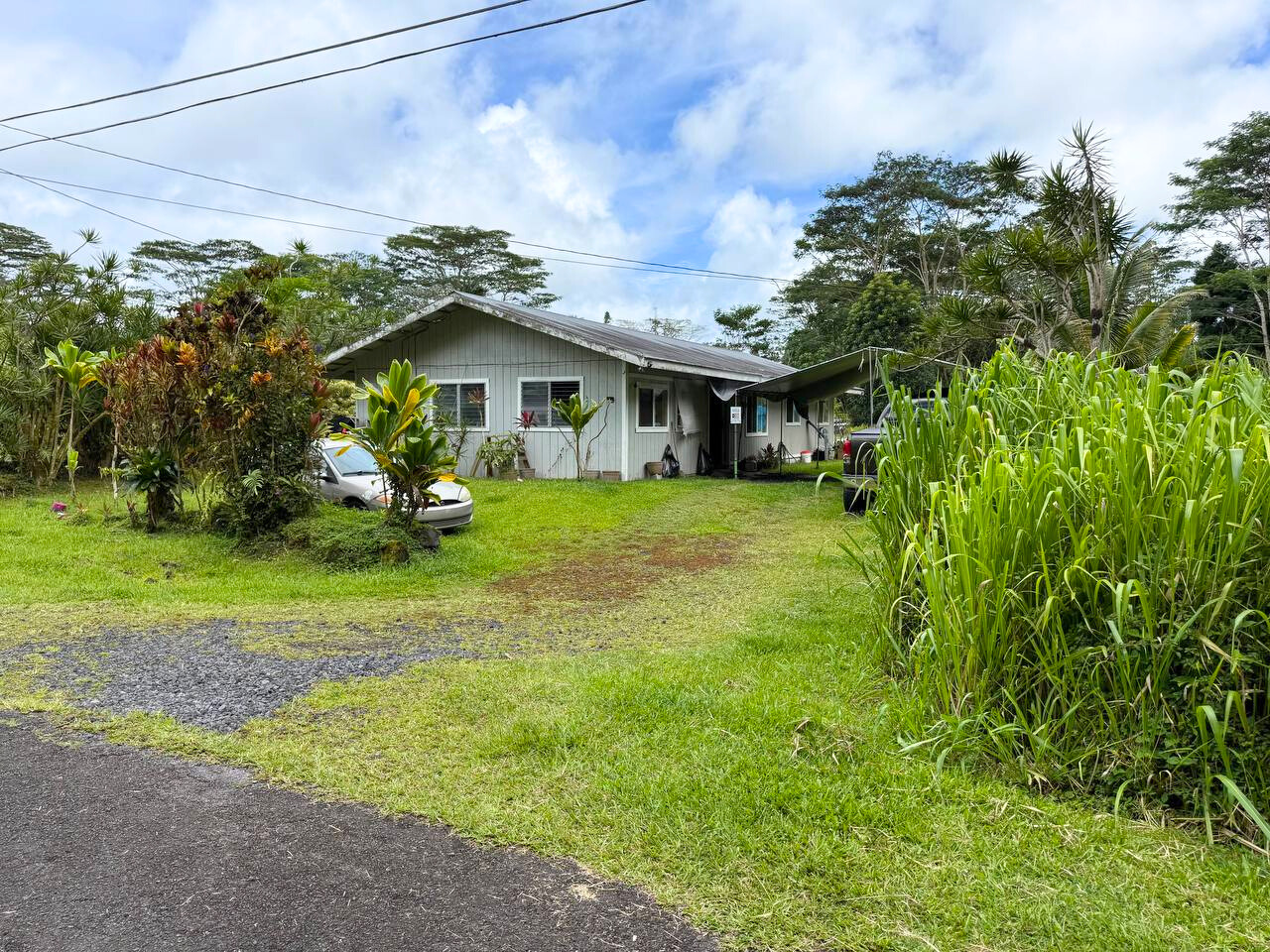 14-3276 Pualaa Road Pahoa, HI 96778 - Photo 5 of 8 a view of a house with a yard and sitting area