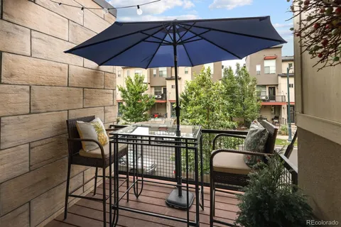 a view of balcony with wooden floor and potted plant