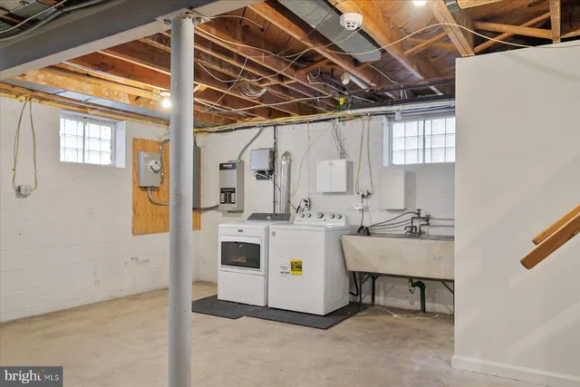 a bathroom with a sink mirror and vanity
