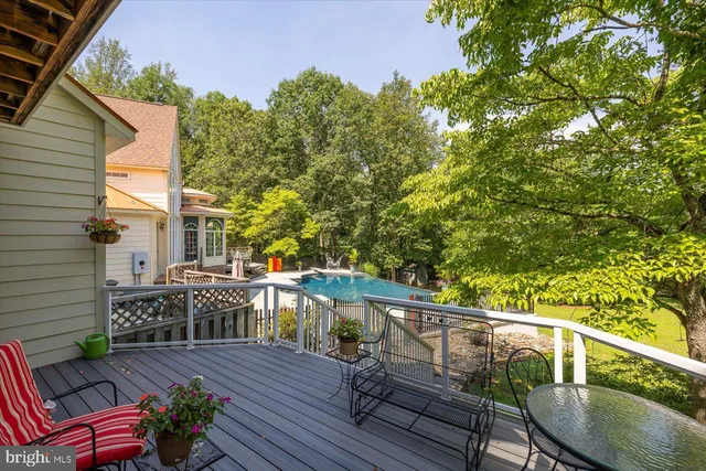 a view of a livingroom with furniture and a book shelf