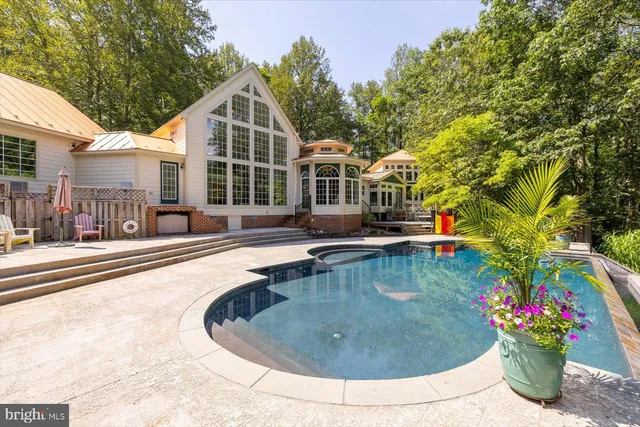 a view of a livingroom with workspace and a window