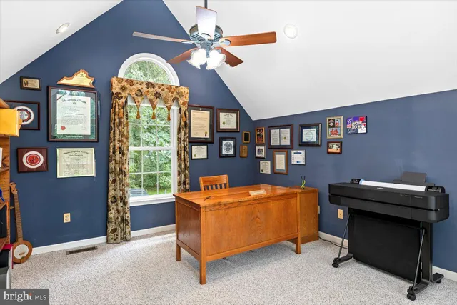 a kitchen that has a lot of cabinets in it and wooden floors