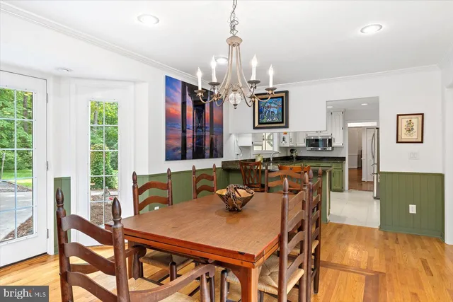 a hallway with couches and wooden floor