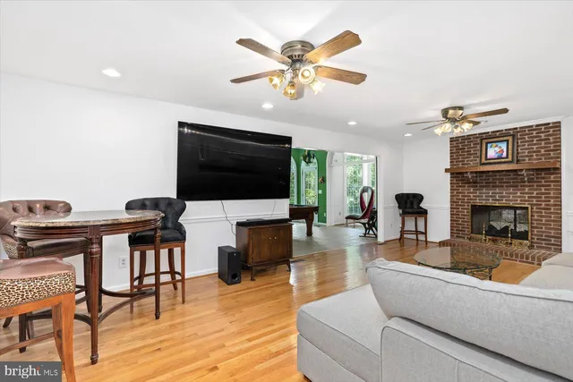 a bedroom with a bed and a large mirror on the dresser