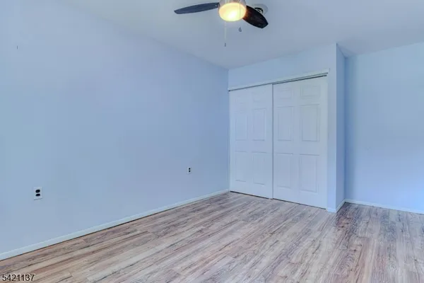 a view of a livingroom with wooden floor