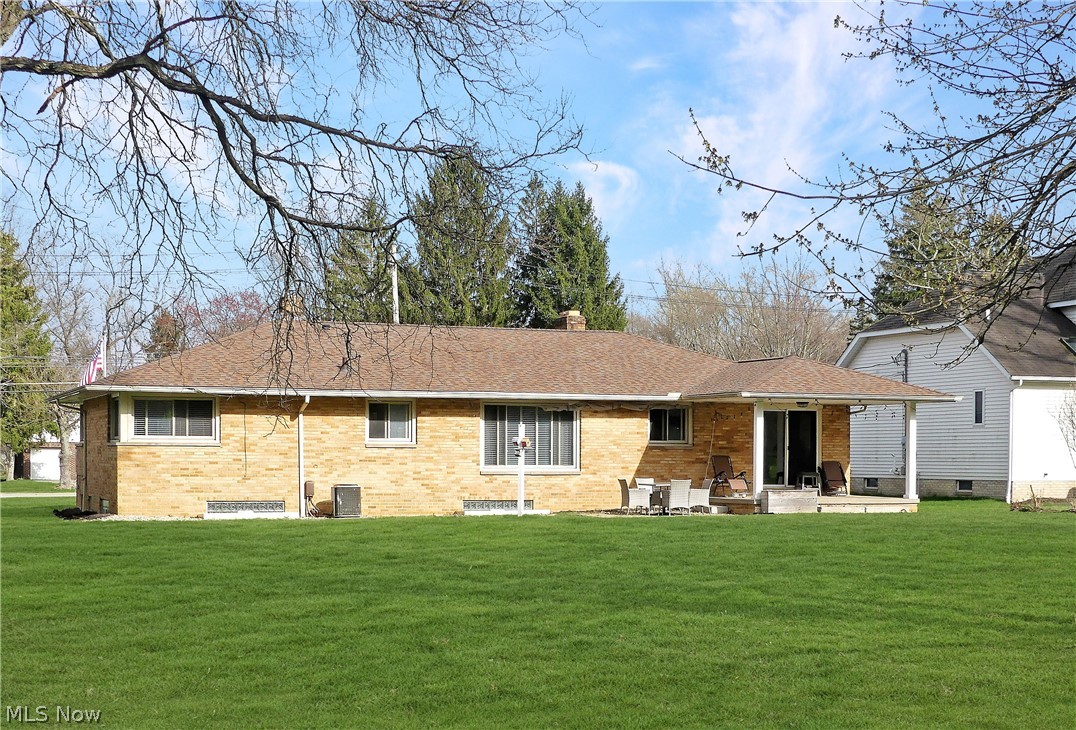 6510 Crossview Road Independence, OH 44131 - Photo 20 of 21 Back of house featuring a yard, a patio area