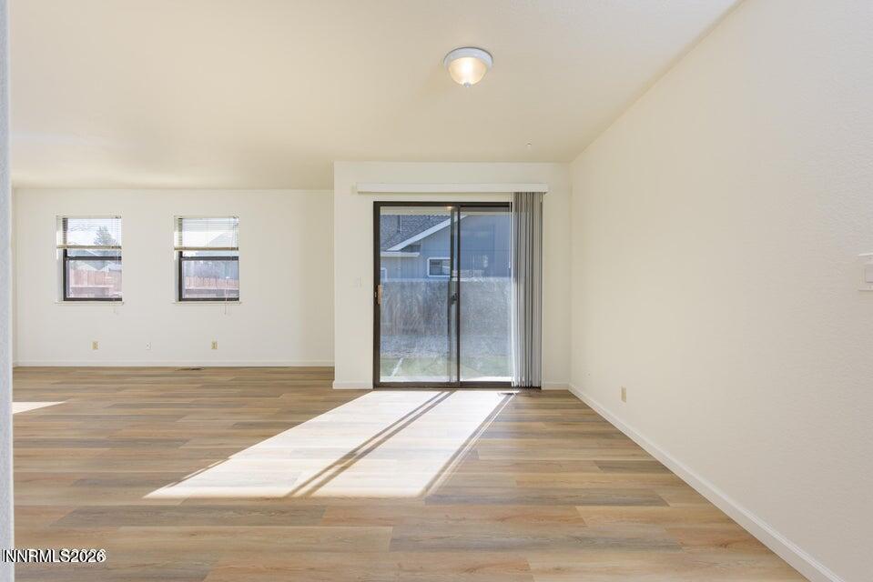3532 Haystack Drive Carson City, NV 89705 - Photo 13 of 34 a view of an empty room with wooden floor and a window