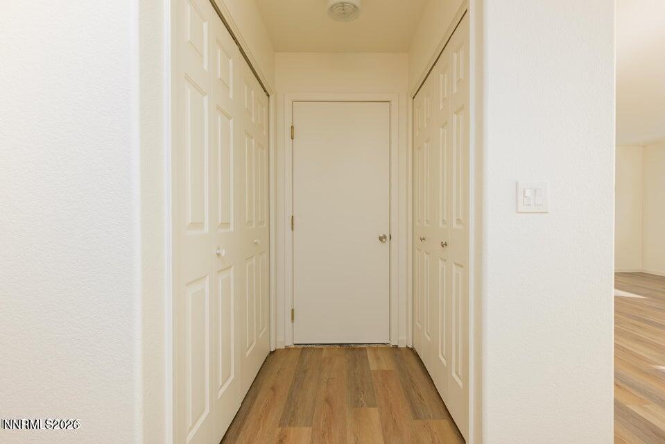 3532 Haystack Drive Carson City, NV 89705 - Photo 17 of 34 a view of a hallway with wooden floor