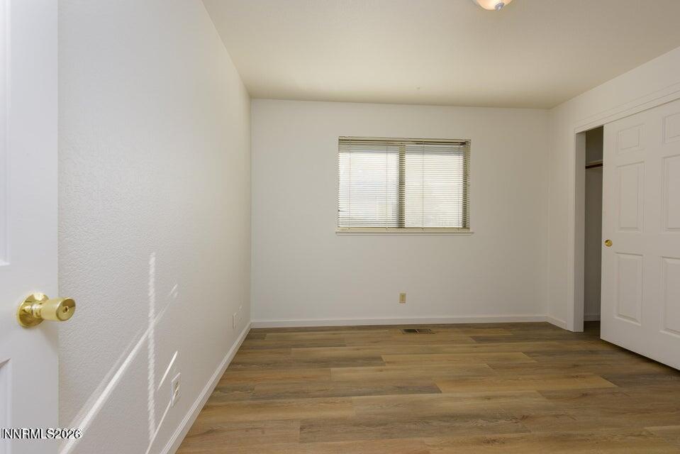3532 Haystack Drive Carson City, NV 89705 - Photo 23 of 34 an empty room with wooden floor and window