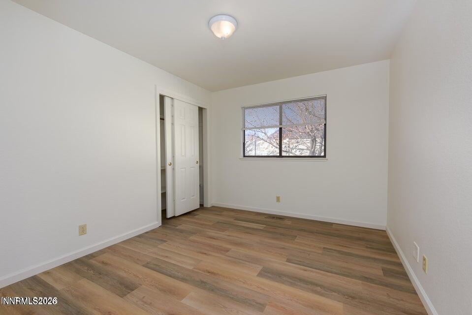 3532 Haystack Drive Carson City, NV 89705 - Photo 26 of 34 an empty room with wooden floor and windows