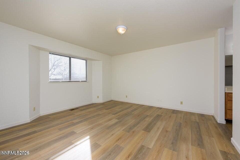 3532 Haystack Drive Carson City, NV 89705 - Photo 28 of 34 an empty room with wooden floor and windows