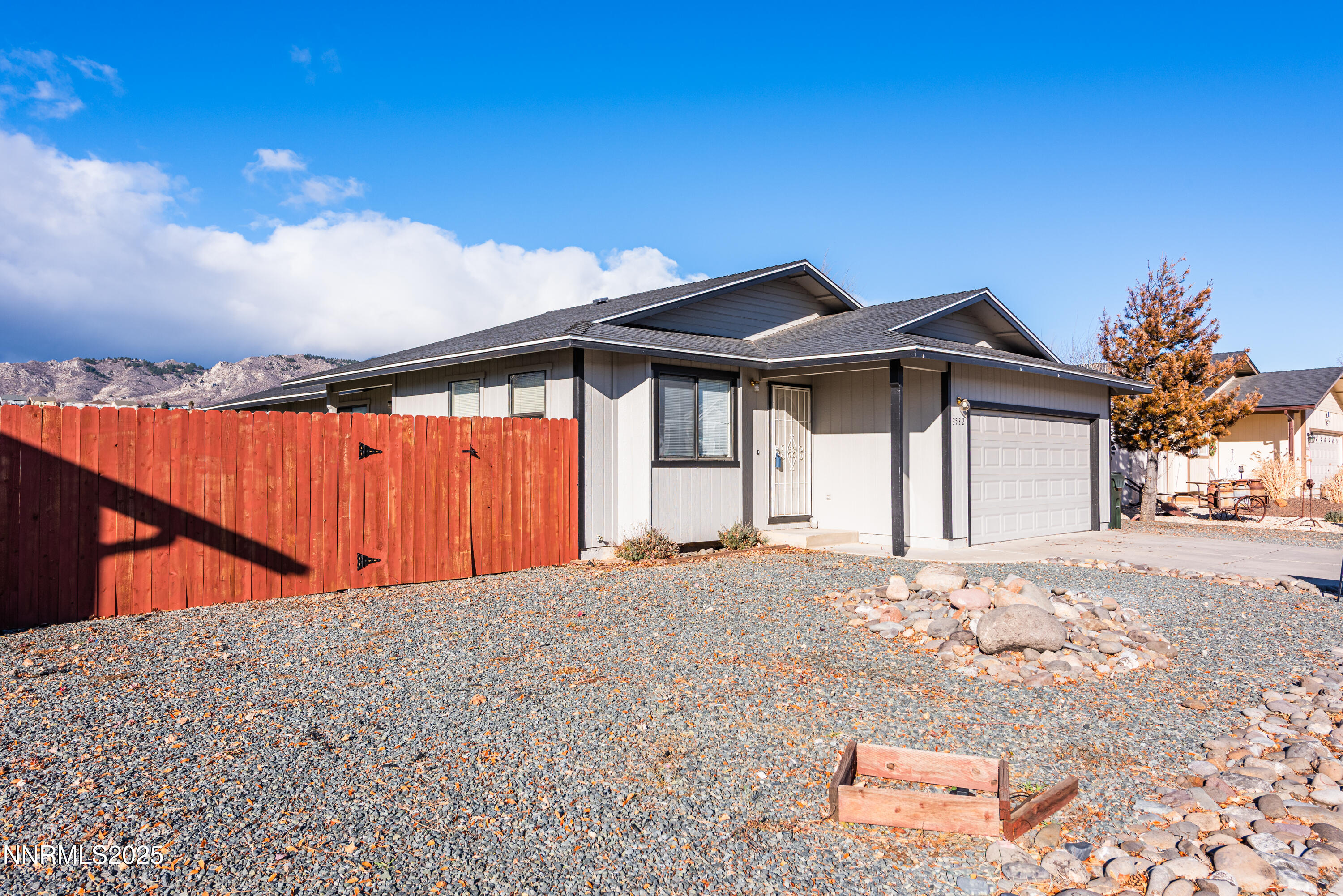 3532 Haystack Drive Carson City, NV 89705 - Photo 3 of 34 a front view of a house with large trees