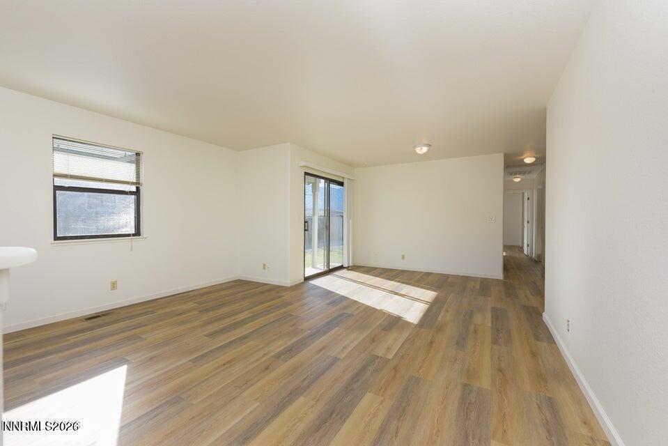 3532 Haystack Drive Carson City, NV 89705 - Photo 10 of 34 a view of an empty room with wooden floor and a window