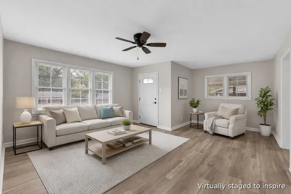 a living room with furniture and a large window