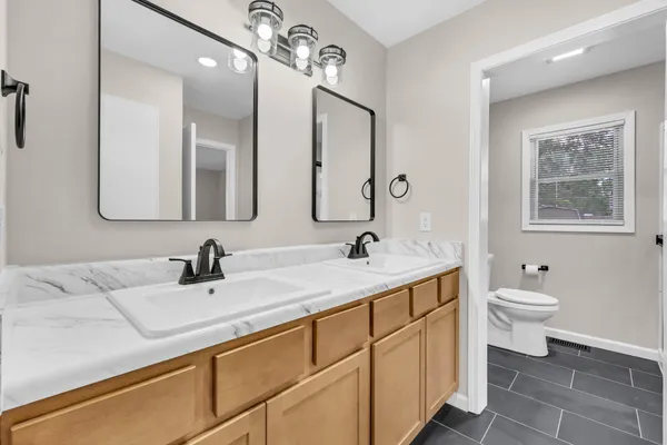 a bathroom with a shower and toilet