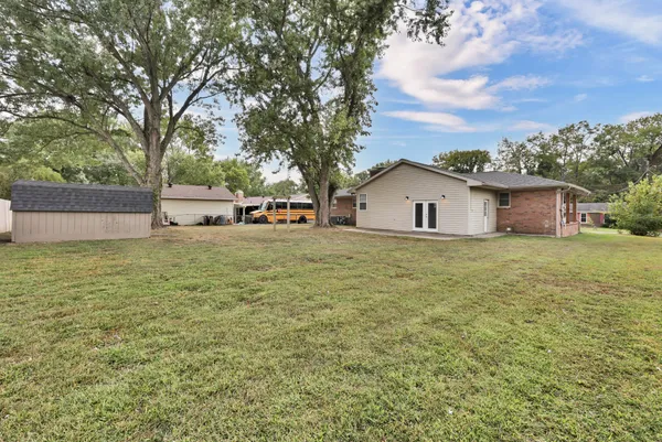 a wooden door in front of a house