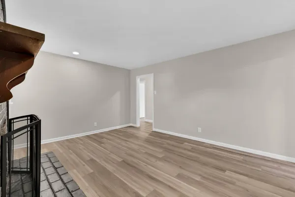 a view of room with wooden floor