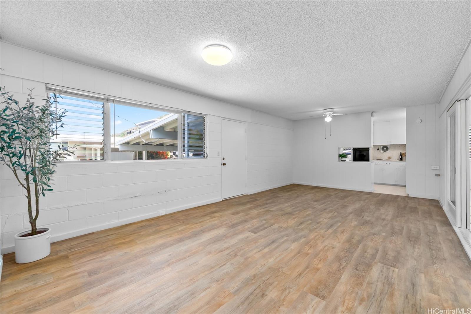 6014 Aimoku Street Honolulu, HI 96821 - Photo 6 of 25 Spacious living room with LVP flooring