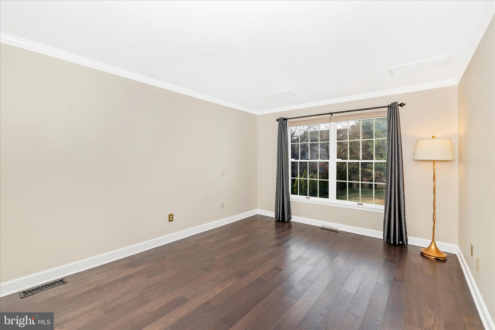 13514 Paradise Church Road Hagerstown, MD 21742 - Photo 18 of 56 an empty room with wooden floor and windows