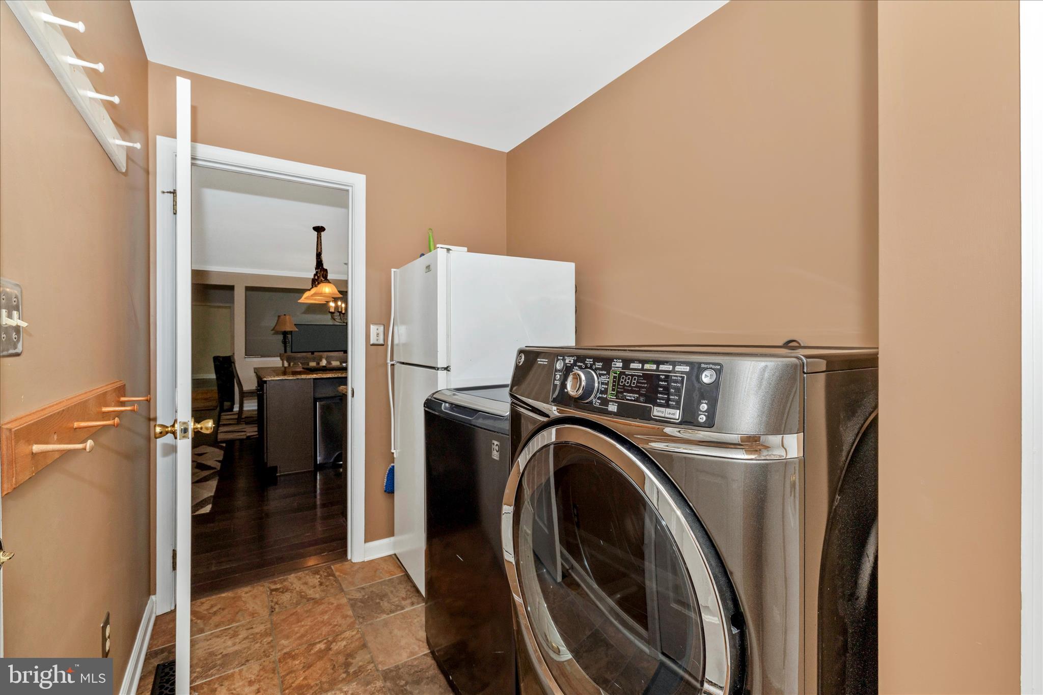 13514 Paradise Church Road Hagerstown, MD 21742 - Photo 20 of 56 a view of a storage & utility room with washer and dryer