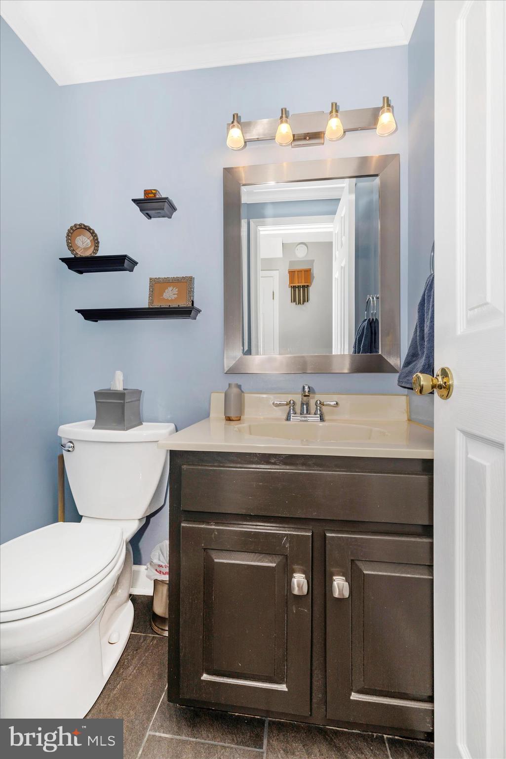 13514 Paradise Church Road Hagerstown, MD 21742 - Photo 21 of 56 a bathroom with a toilet a sink and mirror