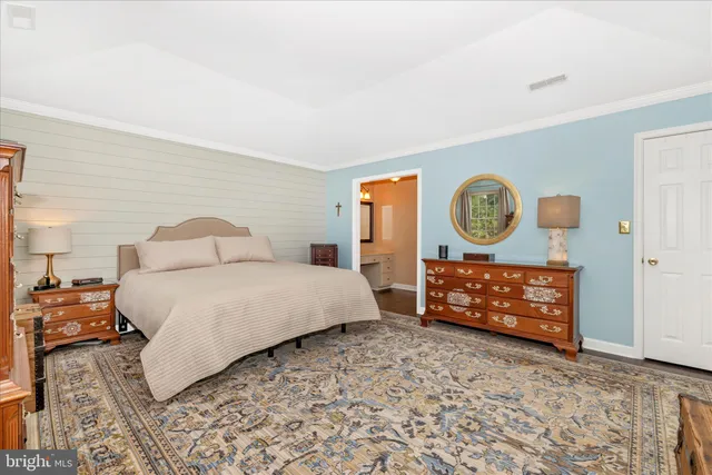 a white bath tub sitting next to a shower