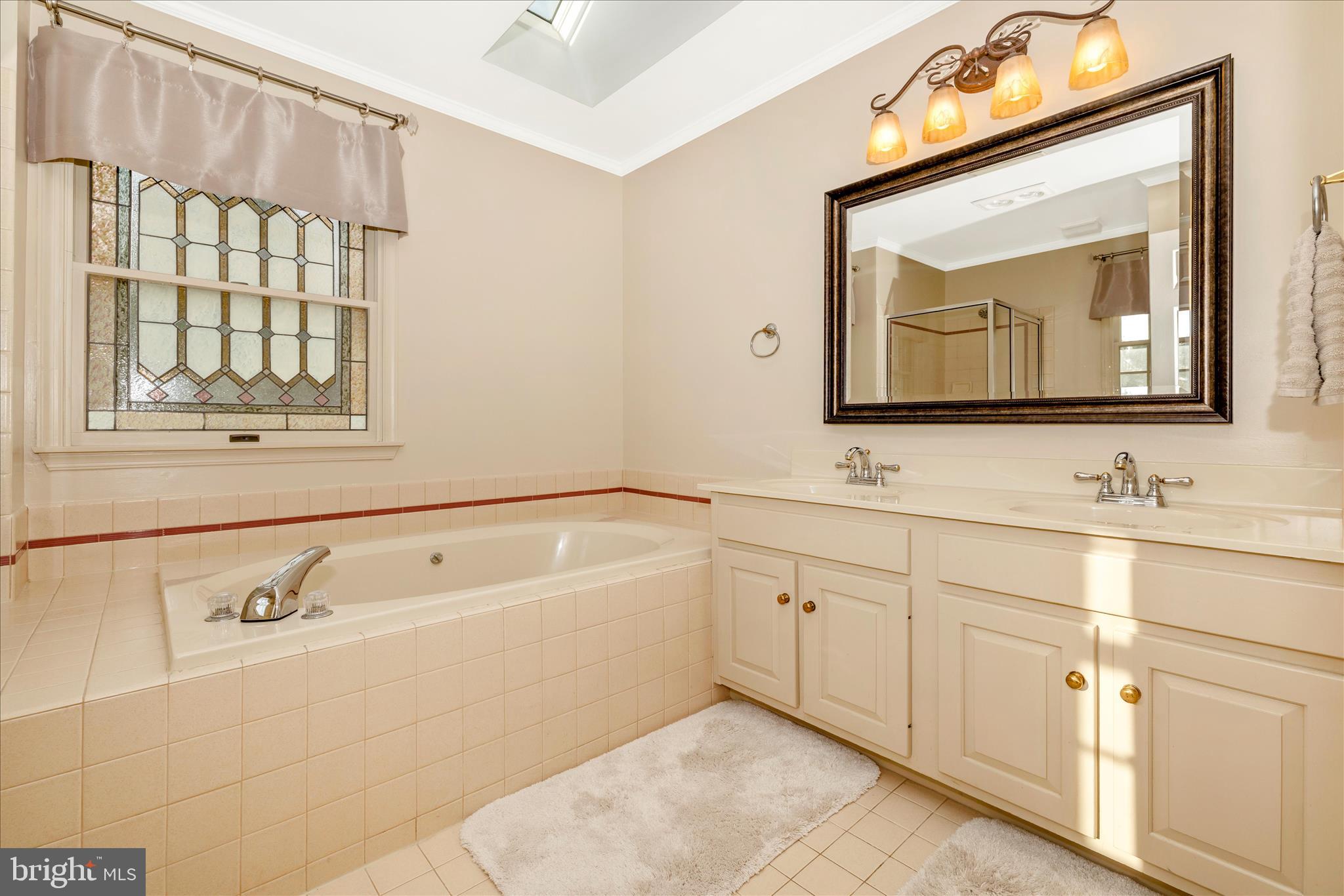 13514 Paradise Church Road Hagerstown, MD 21742 - Photo 27 of 56 a bathroom with a sink vanity and mirror