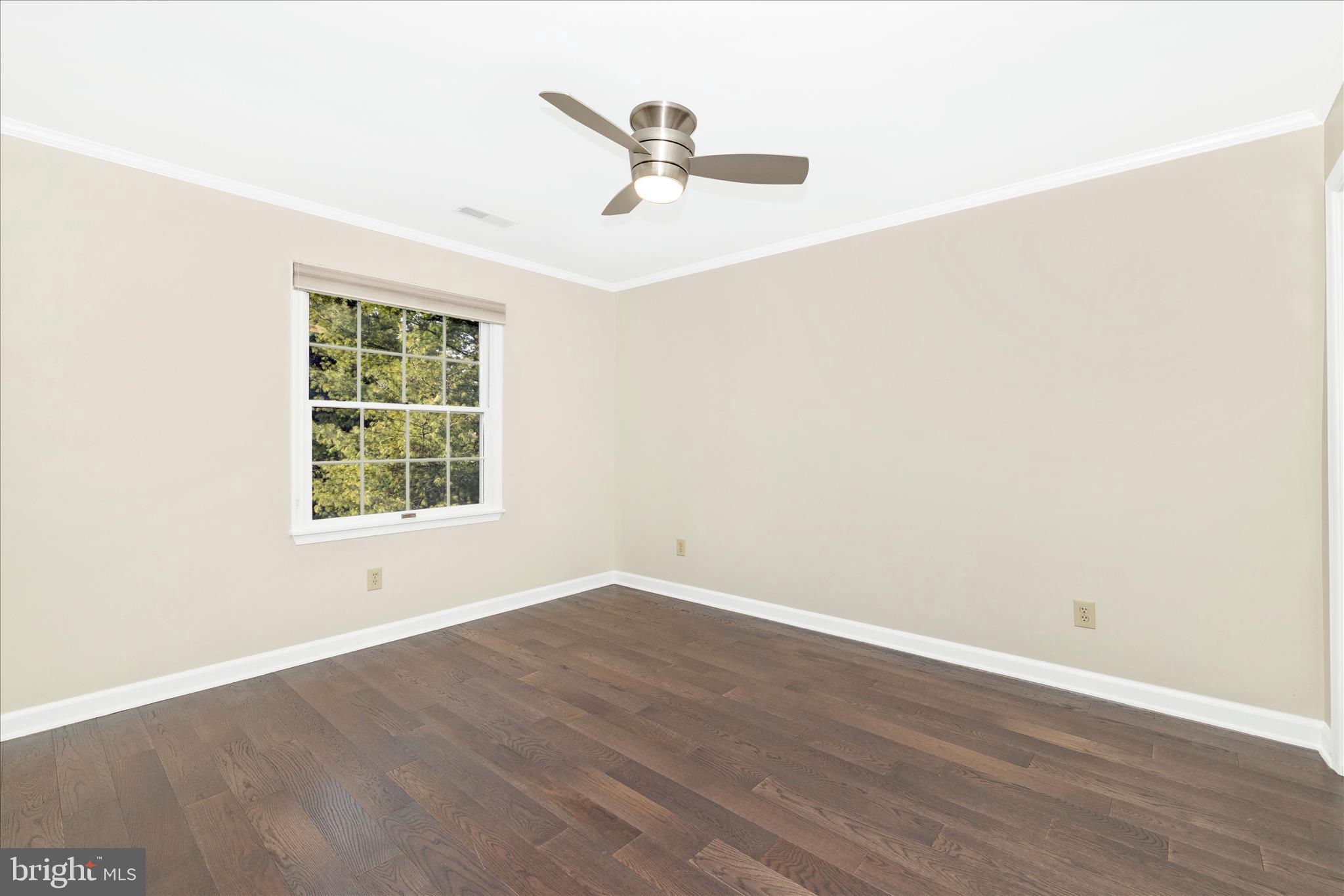 13514 Paradise Church Road Hagerstown, MD 21742 - Photo 33 of 56 an empty room with wooden floor and windows