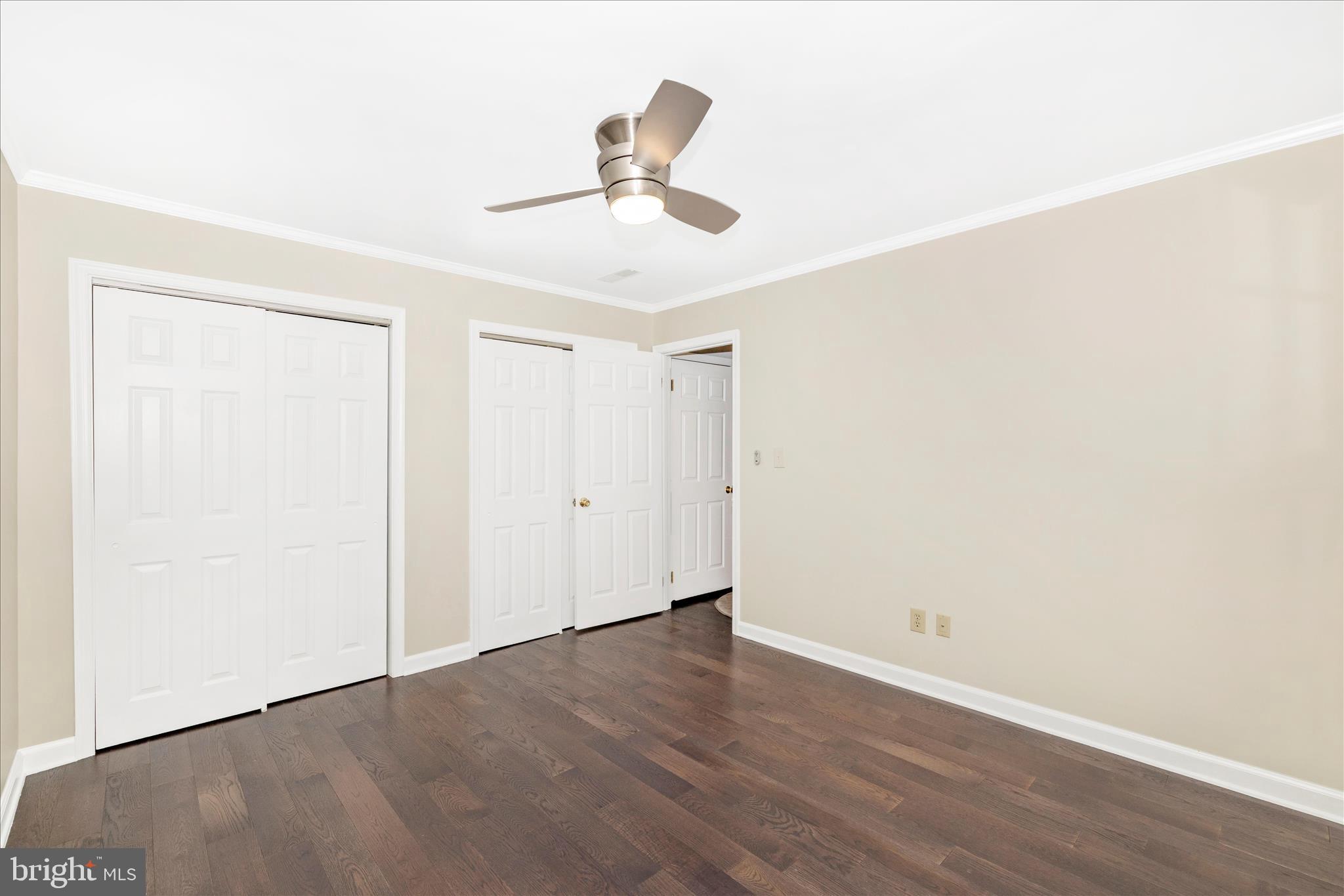13514 Paradise Church Road Hagerstown, MD 21742 - Photo 34 of 56 a view of an empty room with wooden floor and a ceiling fan