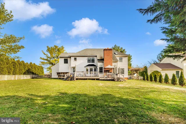 a balcony with wooden floor and outdoor seating