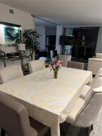 a kitchen with a table and chairs in it