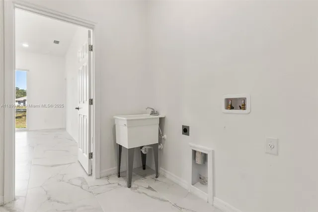 $329,900 | 1918 Wanda Avenue North, Lehigh Acres, FL 33971