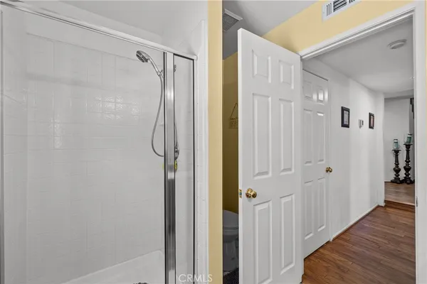 a bathroom with a glass shower door